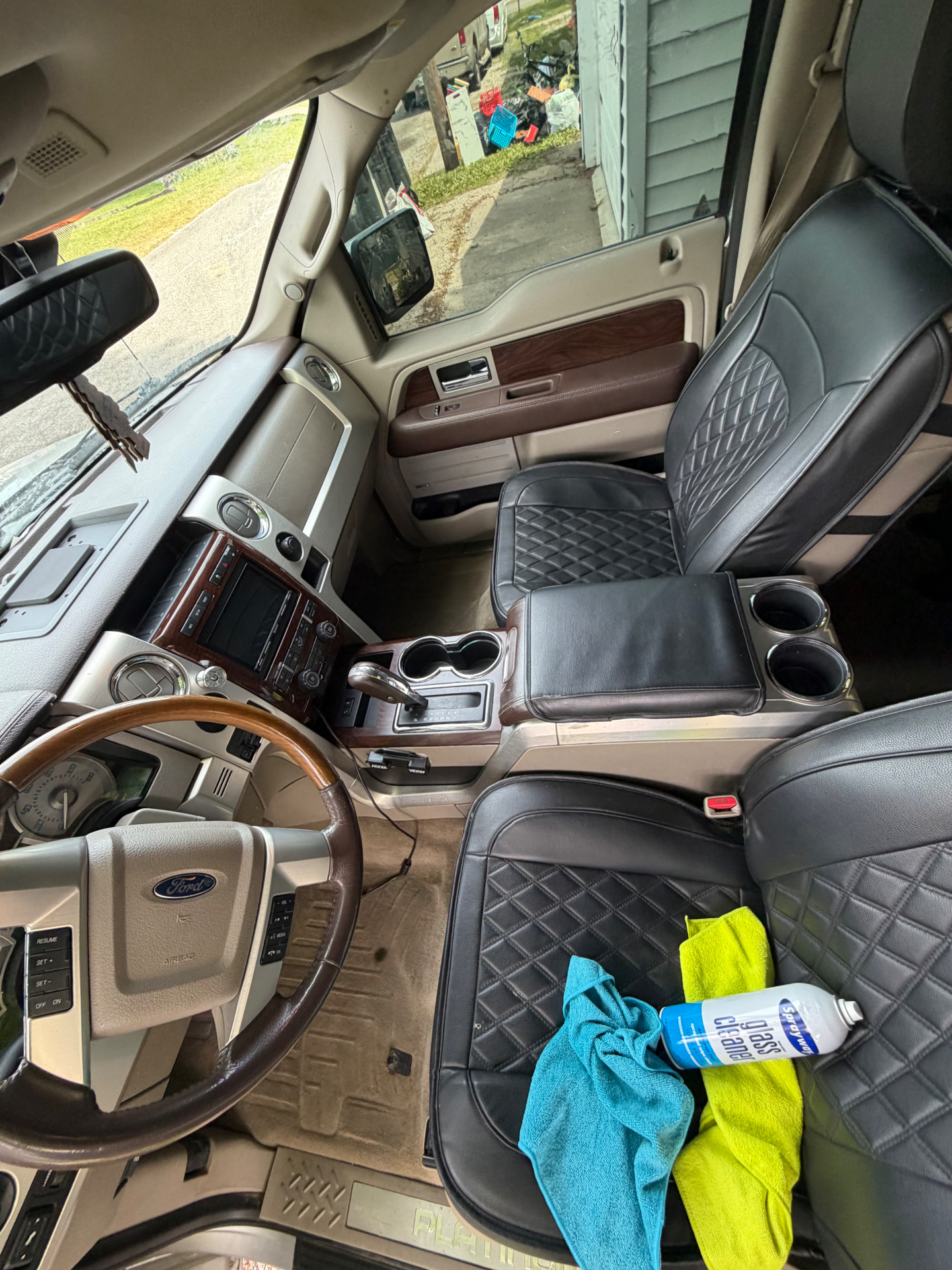 Ford F-150 Platinum front interior mid-detail with glass cleaner and microfibers